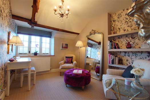 Elegant dressing room adjoining the main bedroom at The Cottage
