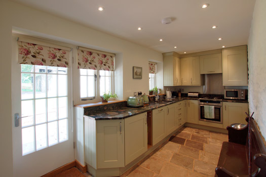 Fully equipped kitchen and dining area inside The Bothy